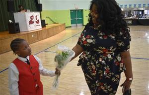  A son giving his mother a bouquet of flowers